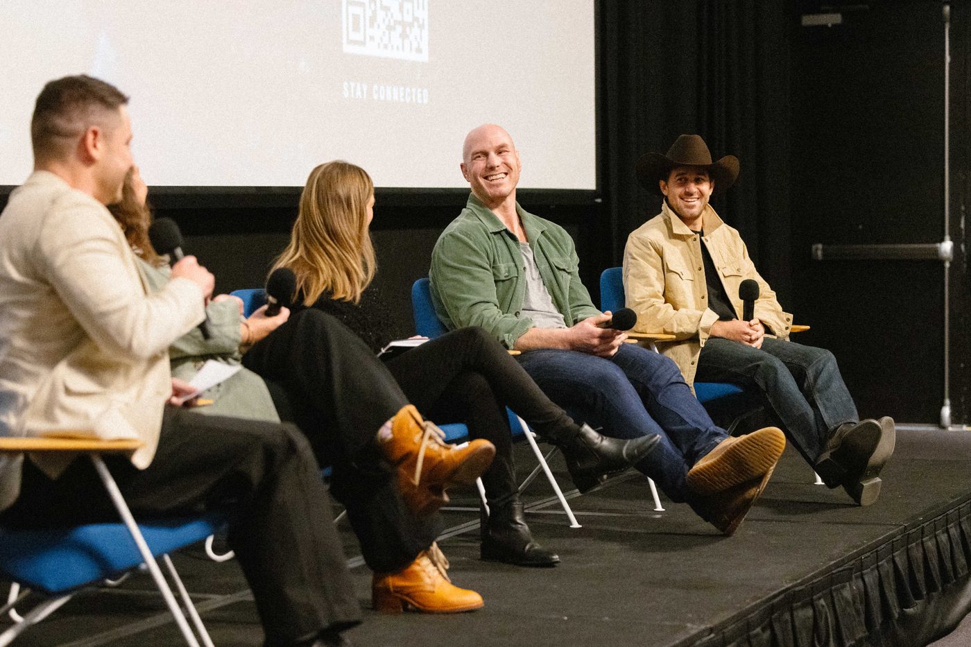 The full Common Wealth panel sharing a laugh on stage at Kambri Cinema