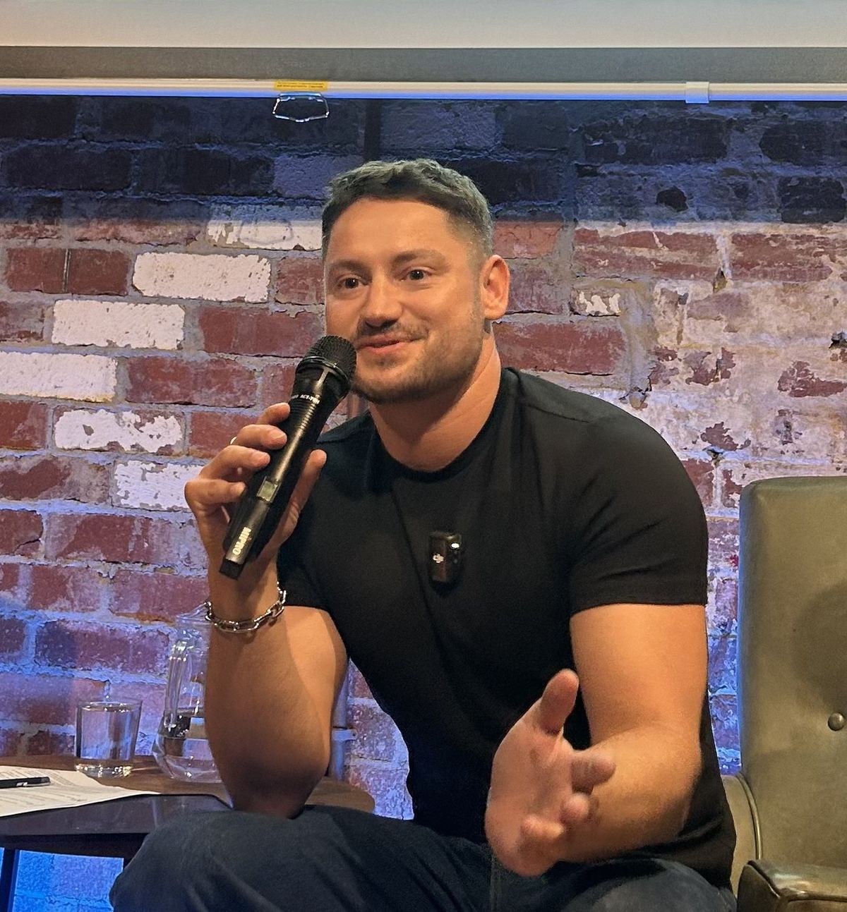 Kane Jackson hosting live with microphone
